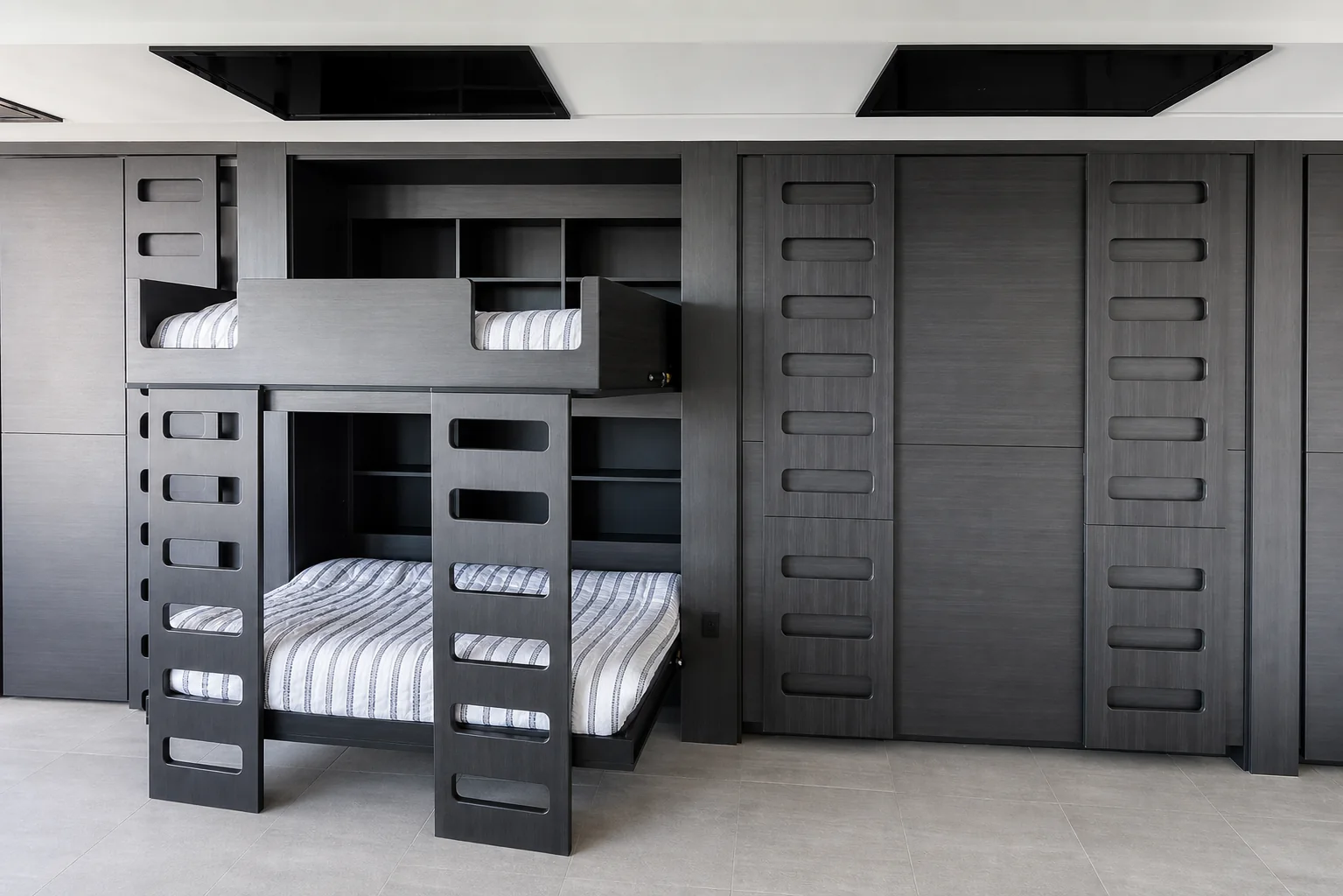 Gray built-in bunk beds with integrated storage built by HUFCO