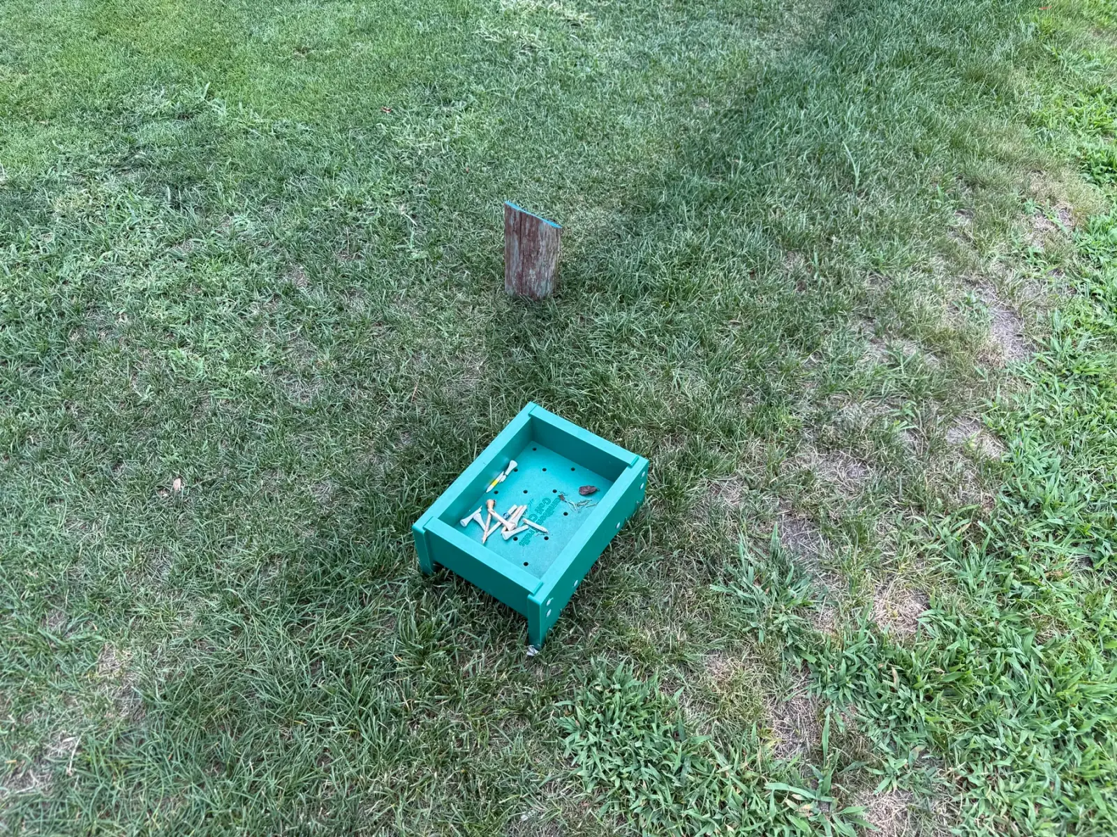 Green broken-tee collection box in use at Hamilton Trails Golf Club
