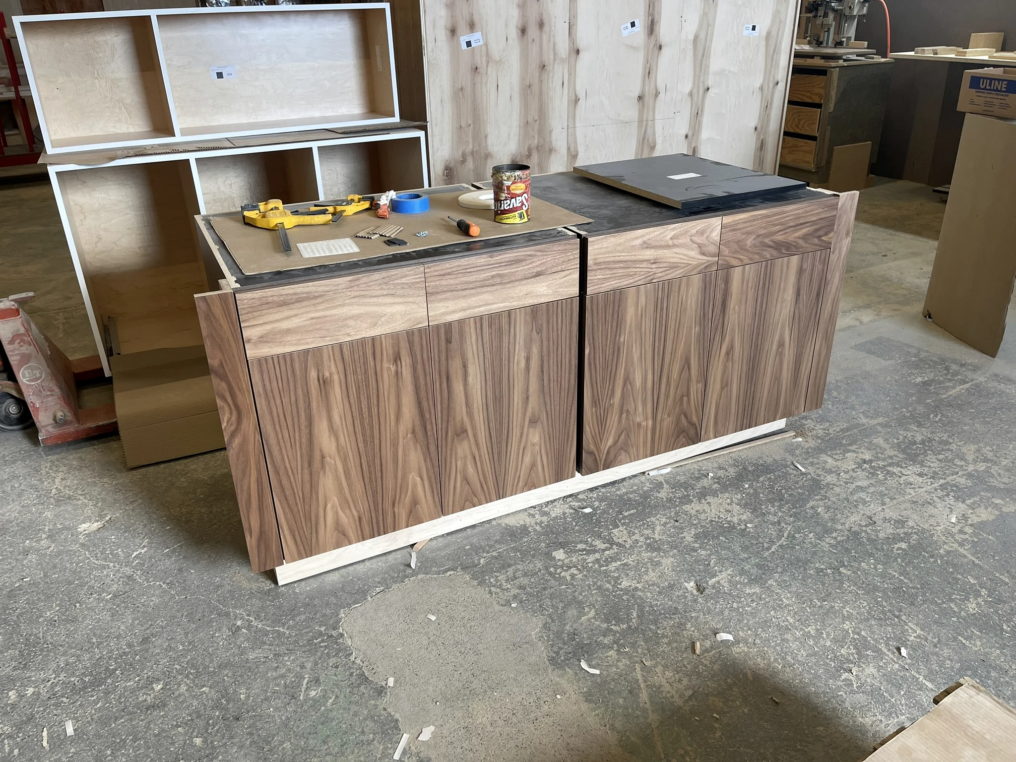 Walnut cabinetry being fabricated in the HUFCO workshop